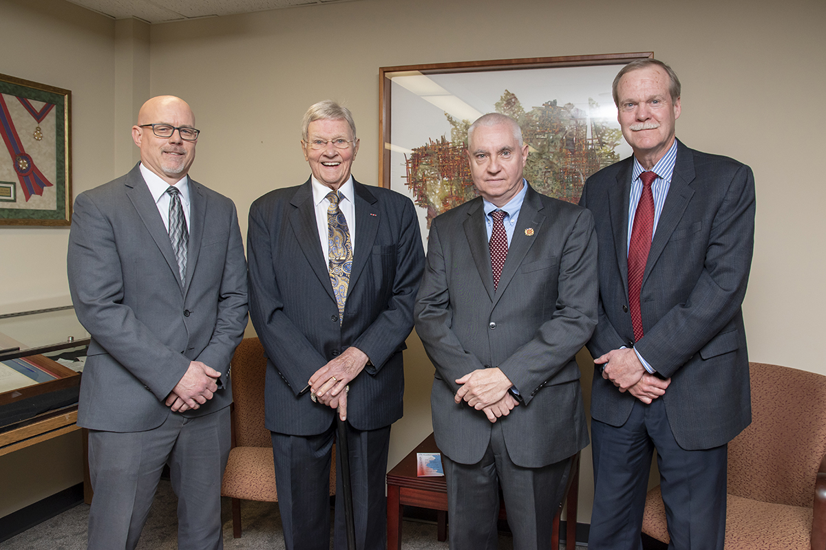 Judge Richard Mills is pictured with three of his former law clerks. Left to Right: Tom Patton, Tom Wilson, Judge Mills and Judge Stuart Borden.