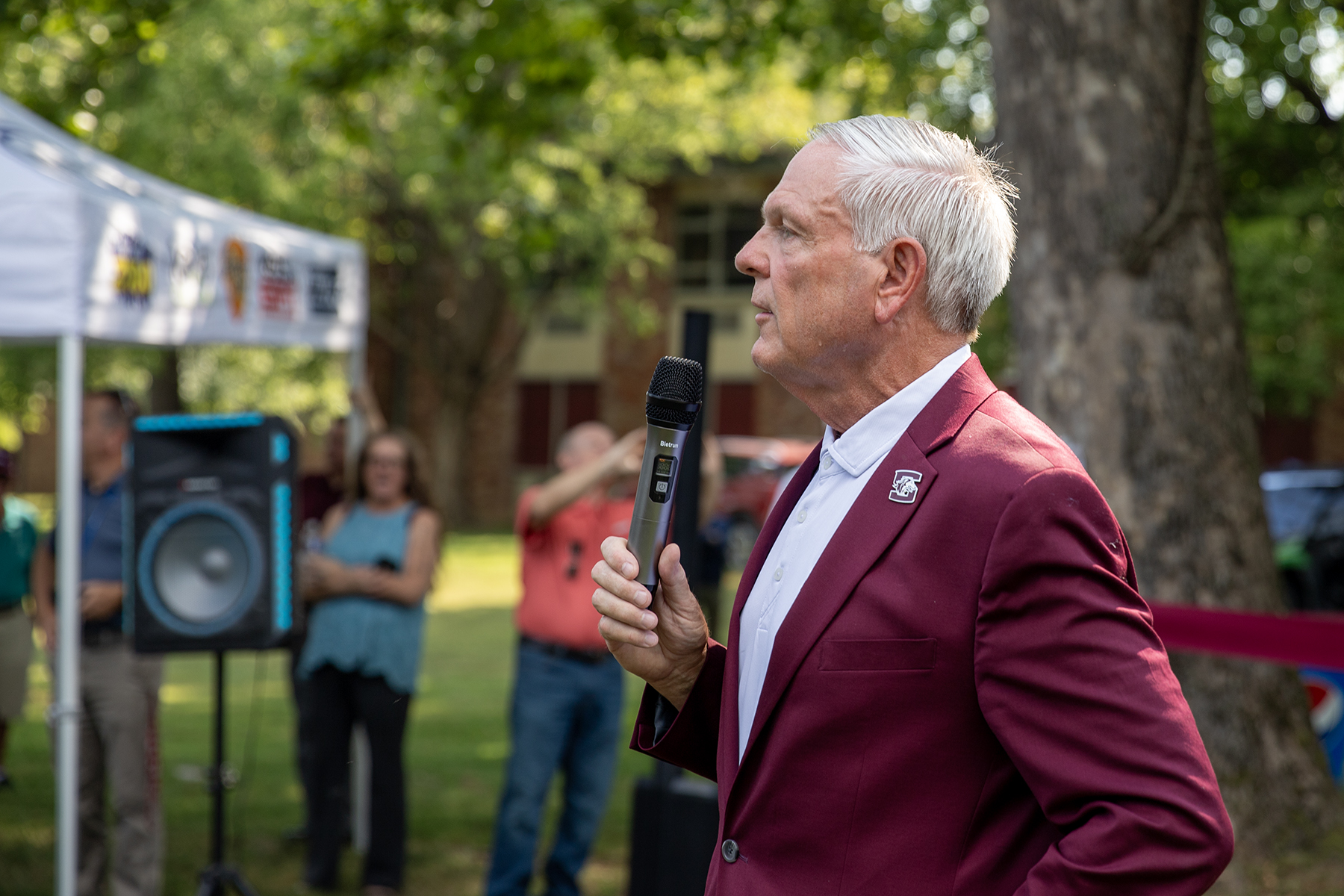 SIU Foundation CEO addresses the crowd at the demolition event on old Greek Row.