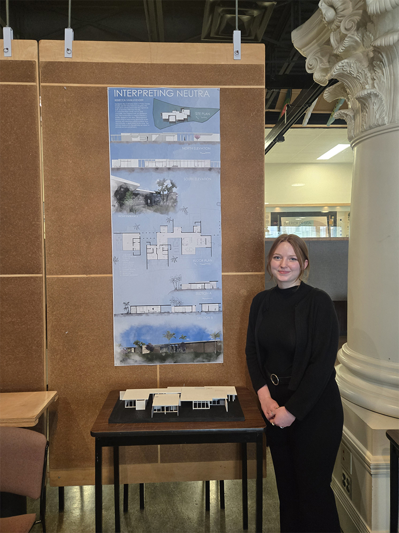 Rebecca VanLuvender stands next to her project in the SIU architecture studio.