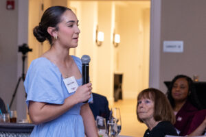 Gianni Torres, a newly admitted Florida student and softball catcher who has committed to SIU, speaks to alumni and friends during the Chancellor’s Reception in Naples, sharing that she toured campus in January and quickly knew she wanted to attend Southern Illinois University Carbondale.