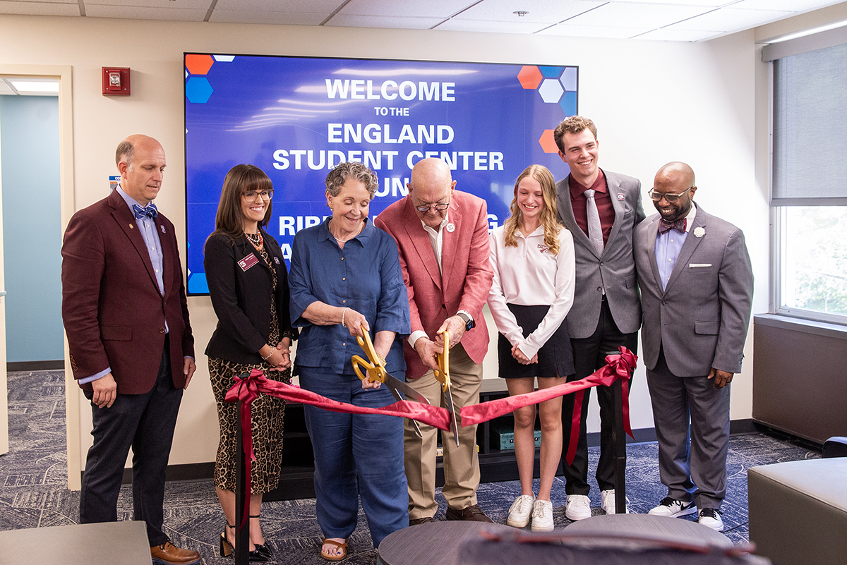 Bob and Pat England cut the ribbon for the England Student Center Lounge.