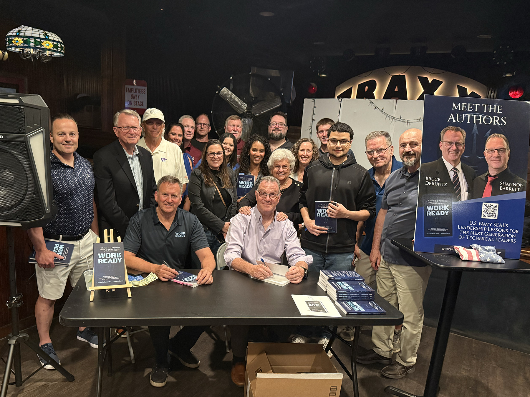 Authors Dr. Bruce DeRuntz and Shannon Barnett are joined byfamily and friends of the late William “Will” Bushelle, including his parents, Bill and Paula Bushelle, during a book signing.