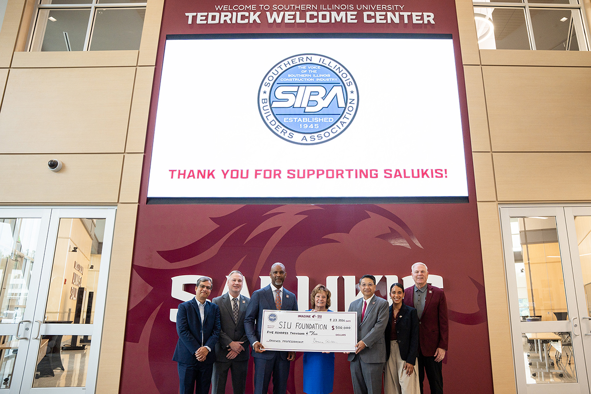Southern Illinois Builders Association presents a $500,000 check for the first endowed professorship in the SIU College of Engineering, Computing, Technology, and Mathematics.