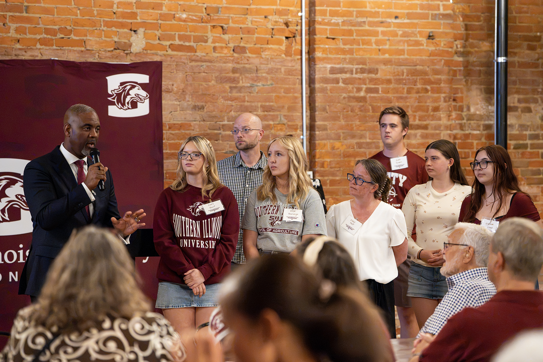 SIU Chancellor Austin A. Lane introduces prospective students to the crowd at the Chancellor's Reception in Champaign.