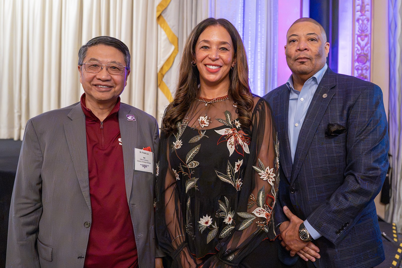 From left, Dr. Xiaoqing “Frank” Liu, dean of SIU's College of Engineering, Computing, Technology, and Mathematics; Alexis Yates; and Shon Yates gather following the announcement of the Yateses' $1 million commitment to expand opportunities for engineering students during the Chancellor's Reception on Oct. 28 in Chicago.