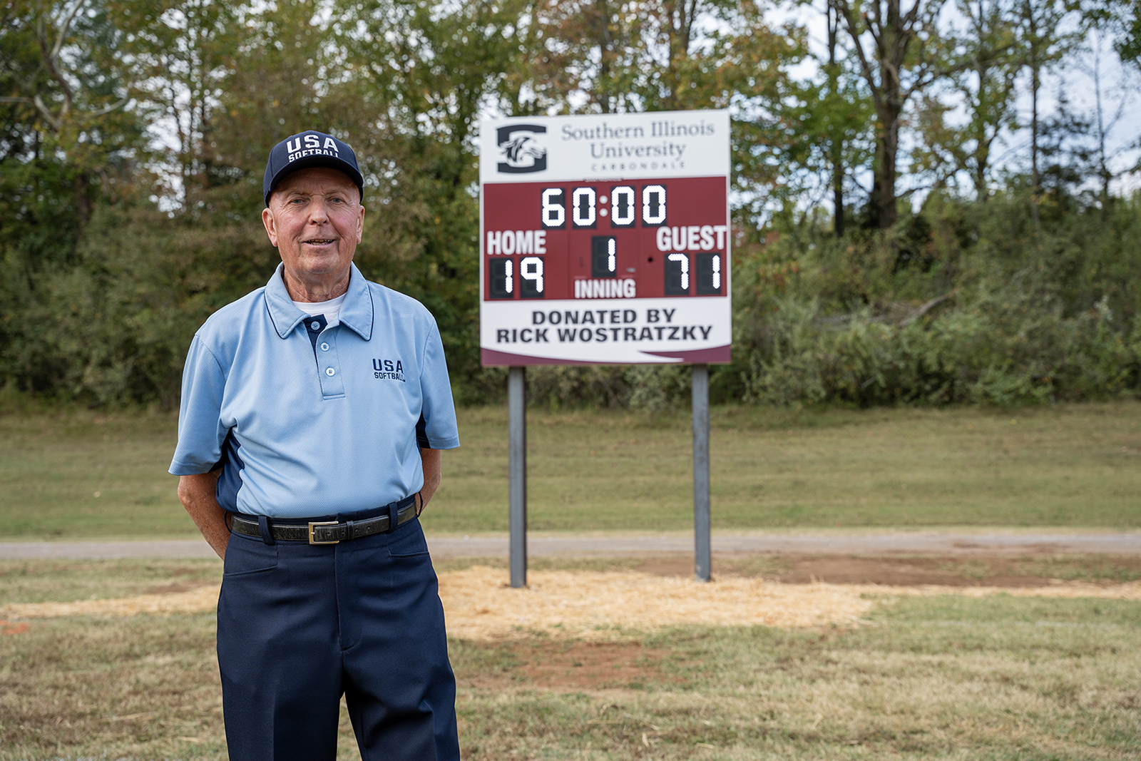 Rick Wostratzky stands in front of the new intramural scoreboards at Southern Illinois University Carbondale.